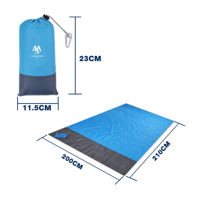 A large blue picnic blanket in a carry pouch, featuring dimensions and a logo on the pouch.