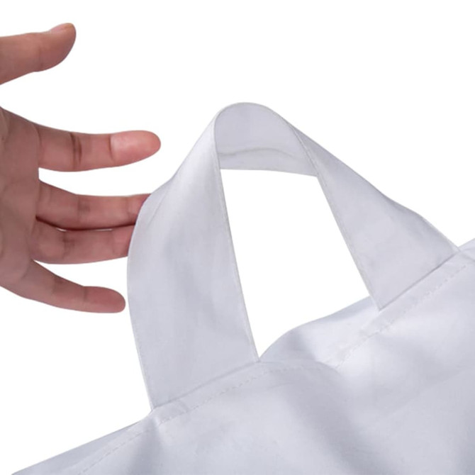 A hand holding a white bag with a handle, showcasing the bag's design and stitching details.