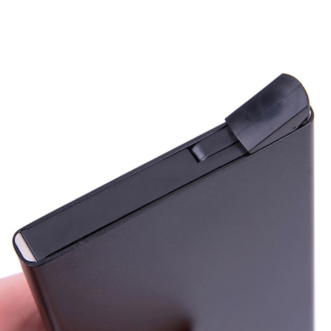 A sleek black metal RFID card holder featuring a minimalist design and a secure closure mechanism.