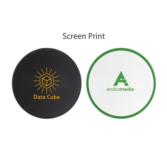 A foldable frisbee in black and white with green trim, featuring screen-printed logos.