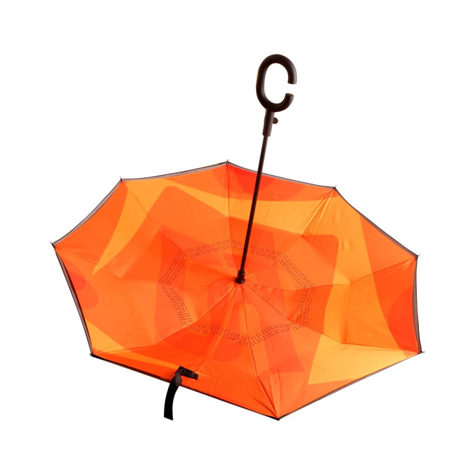 An orange reversible folding umbrella with a curved handle and a contrasting inner layer design.