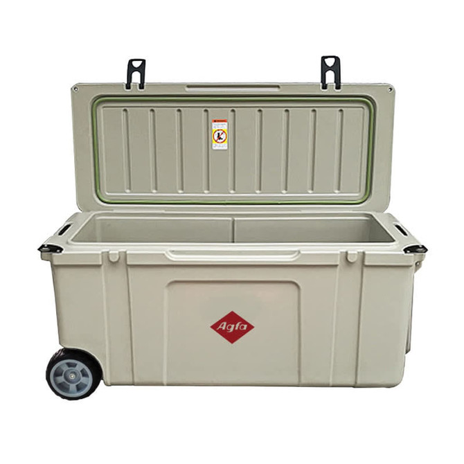 A 120L cooler box with wheels, featuring a light green colour and a logo on the side. The lid is opened.