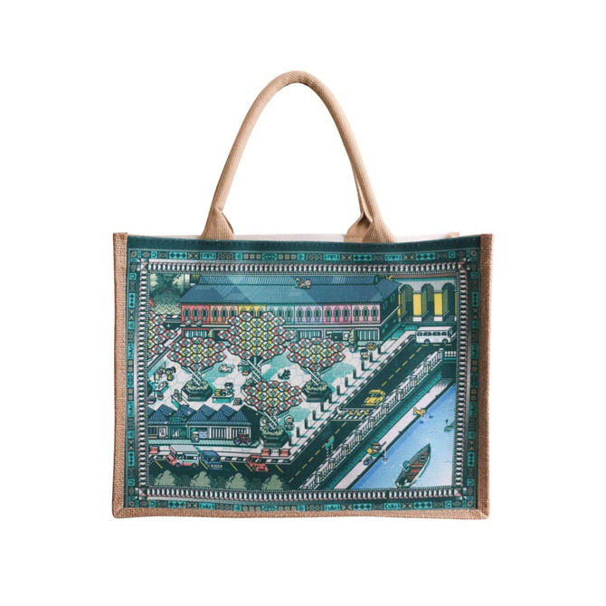 A jute and canvas tote bag featuring a colourful design of a waterfront scene with boats and buildings.
