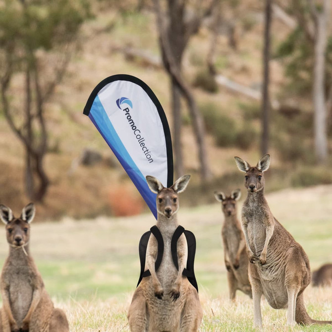 A teardrop-shaped flag in blue and white stands behind a backpack, with kangaroos in a natural landscape.
