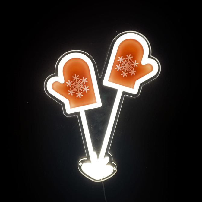 A neon LED sign featuring two orange mittens with white snowflake designs, illuminated against a dark background.