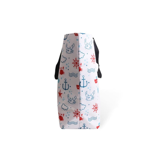 A large polyester cooler tote bag featuring a nautical design in red, blue, and white, with black handles.