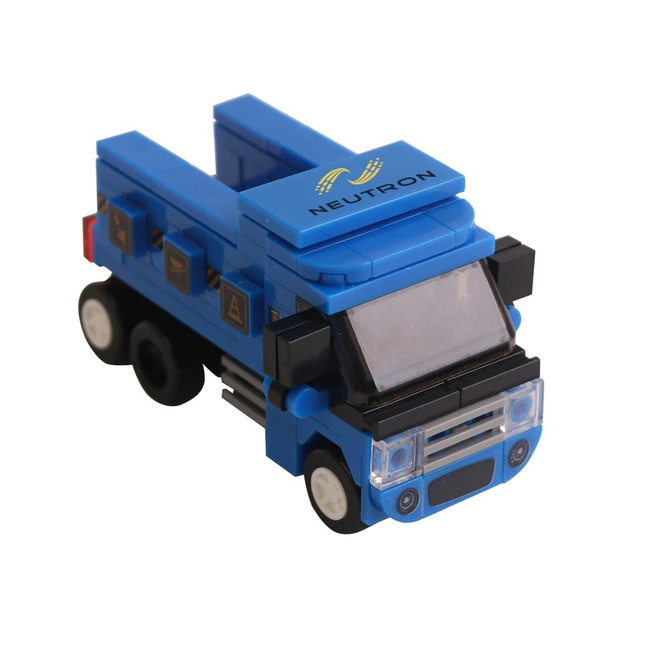 A blue building block truck featuring a transparent windshield and various black details. It has a logo on the side.