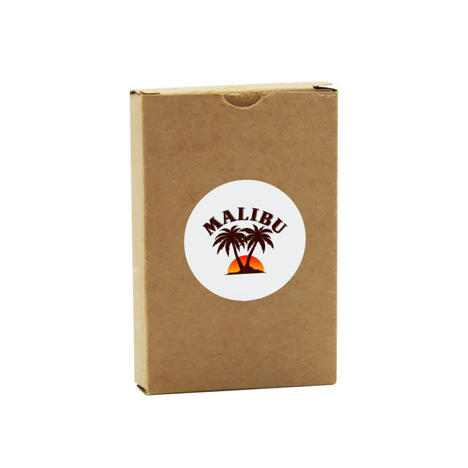 A brown cardboard box containing eco-friendly playing cards, featuring a logo with palm trees and a sunset design.