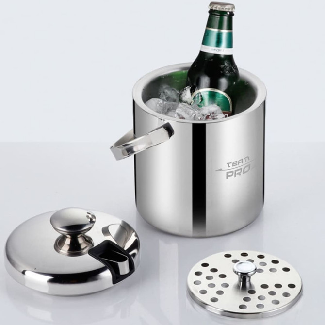 A silver ice bucket with a lid and tongs, containing a beer bottle and ice, on a light surface.