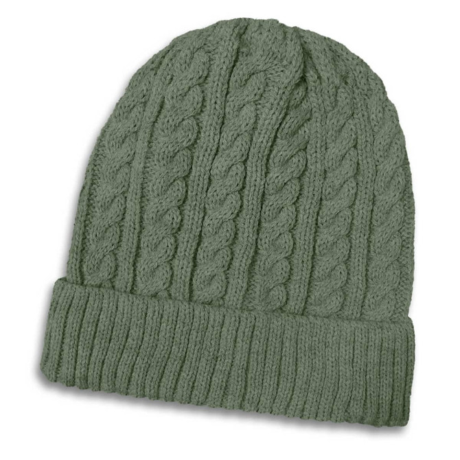 A green knitted beanie featuring a cable pattern and a ribbed cuff, with a logo displayed.