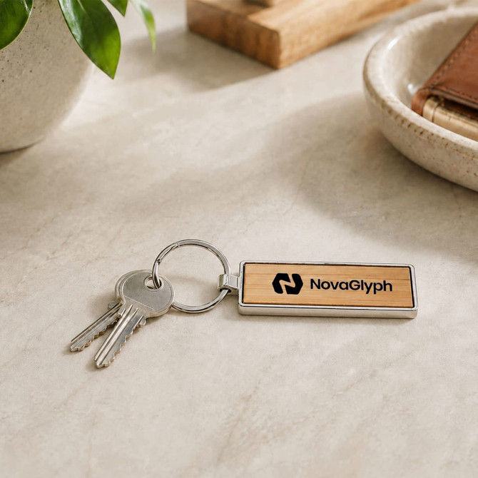 A rectangular wooden keyring in natural wood with a metal keyring attachment and keys beside it.