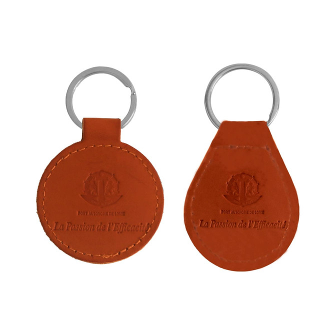 A classic PU leather keyring in orange with a keychain attachment, featuring a branded logo.