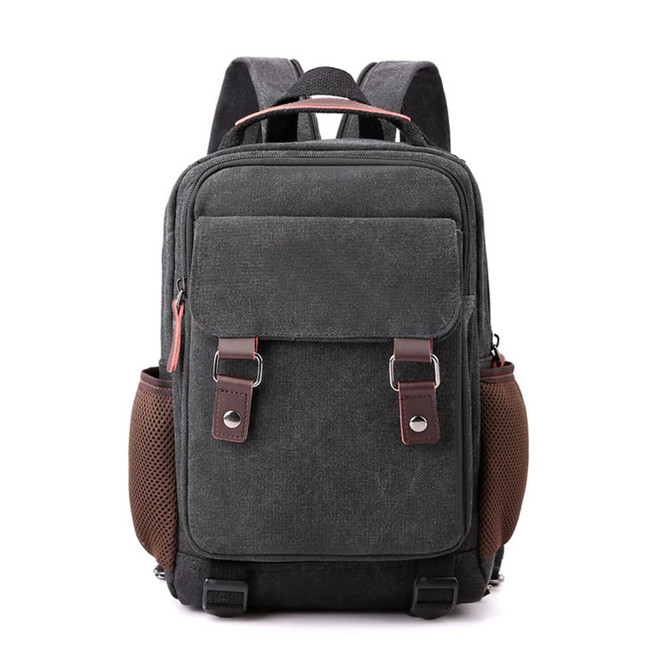 A grey canvas sling backpack with brown accents, featuring two side mesh pockets and front zippered pocket.