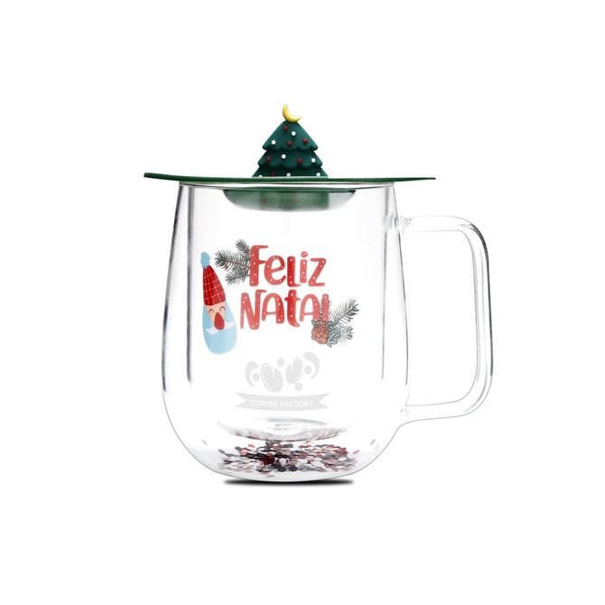 A transparent double wall mug with a green lid topped by a festive Christmas tree design, featuring Christmas-themed text and decorations.