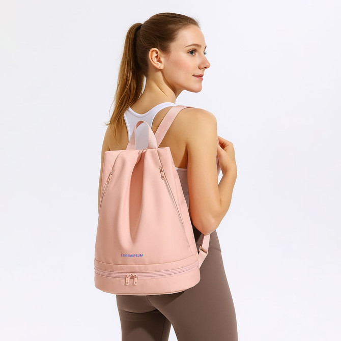 A pink backpack with a handle and adjustable straps, featuring a logo on the front.