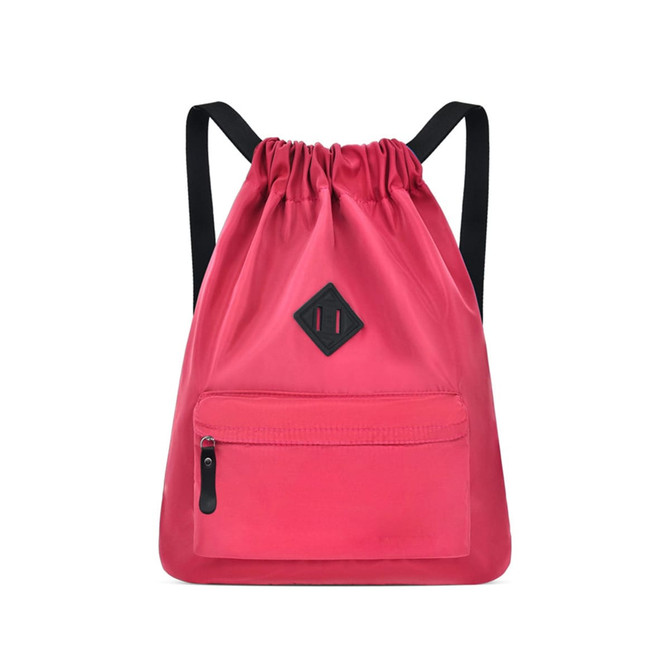 A lightweight drawstring backpack in vibrant pink with a front zip pocket and a black logo patch.
