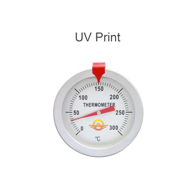 A stainless steel deep fry thermometer with a red indicator and a dial measuring temperatures in Celsius.