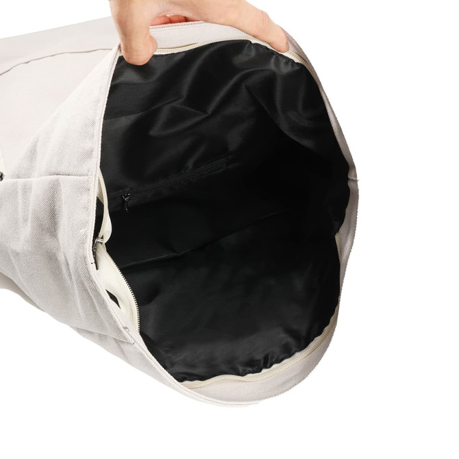 A vintage-style canvas roll-top backpack in light grey, featuring a spacious black interior with a zip pocket.