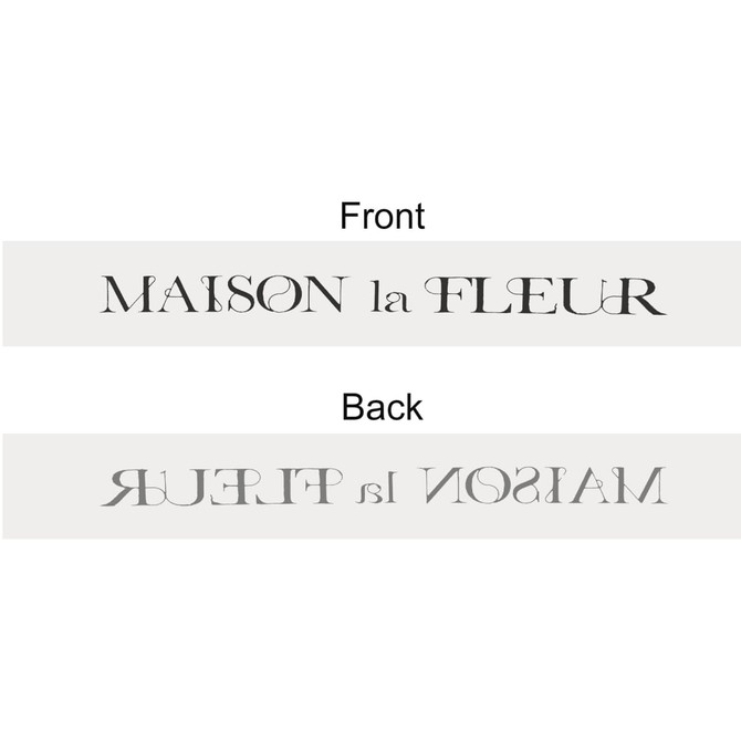 A grey soft ribbon featuring a logo on both sides, with elegant lettering in contrasting colours.