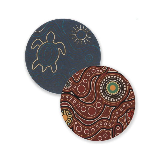 Two round soft diatomaceous coasters featuring Aboriginal-inspired designs in dark blue and reddish-brown colours.
