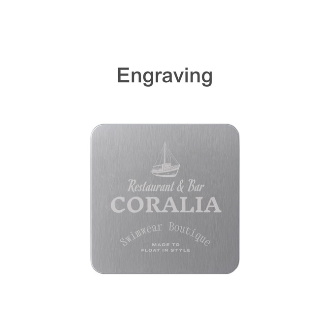 A square metal coaster in silver with an engraved design and a logo.