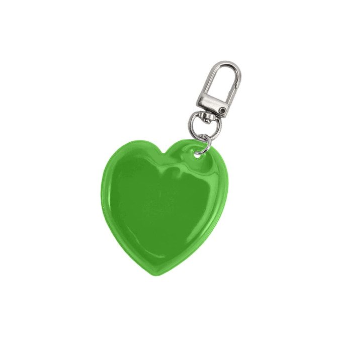 A green heart-shaped reflective keychain with a metal clip attachment. It has a shiny, smooth surface.