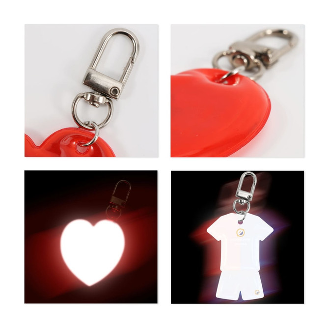 A reflective keychain in the shape of a red heart and a white shirt, featuring a metal clip for attachment.