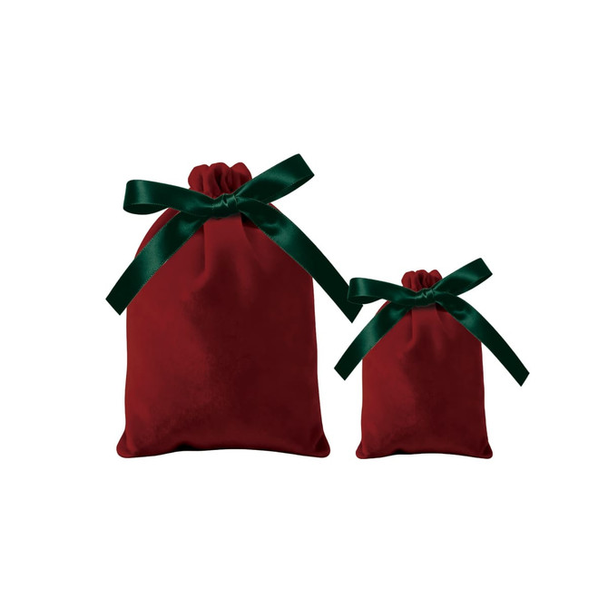 Two red velvet drawstring gift bags, one large and one small, both adorned with green satin ribbons.