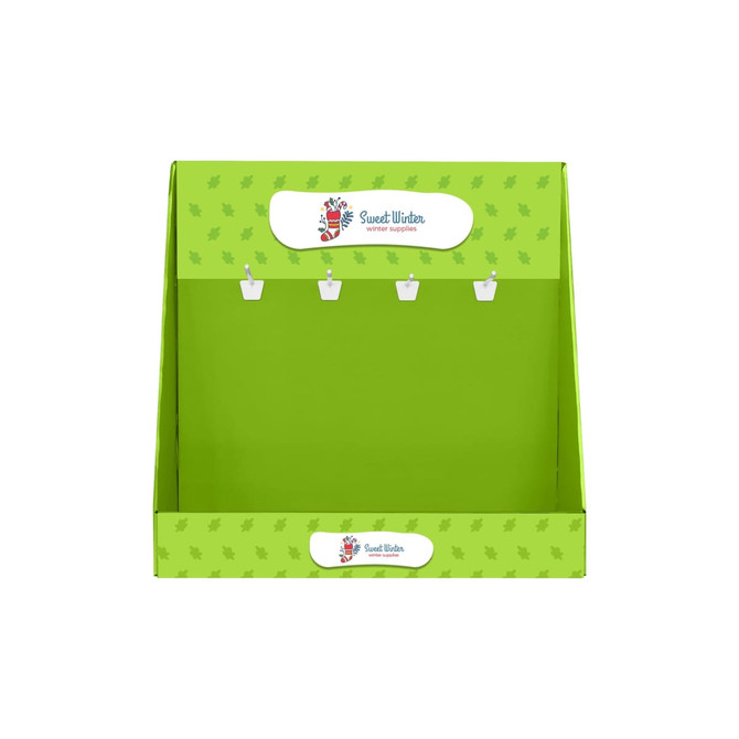 A green corrugated cardboard display with hooks for hanging items, featuring a logo at the top.