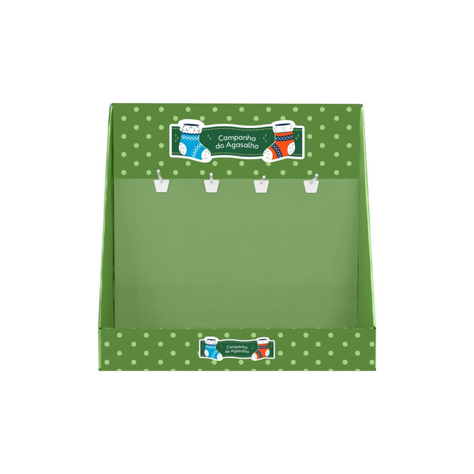 A green corrugated cardboard counter display with polka dots and hooks for hanging items. It features a festive design.