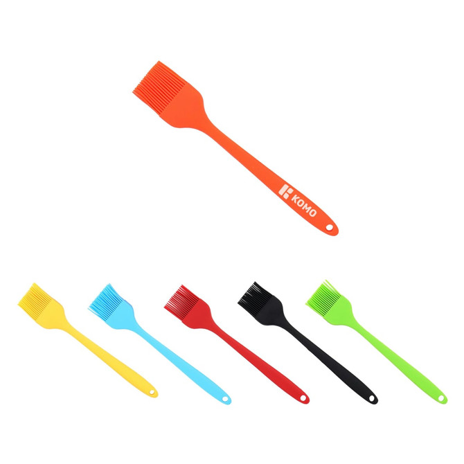A set of pastry brushes in orange, yellow, blue, black, and green, featuring a logo on one brush.