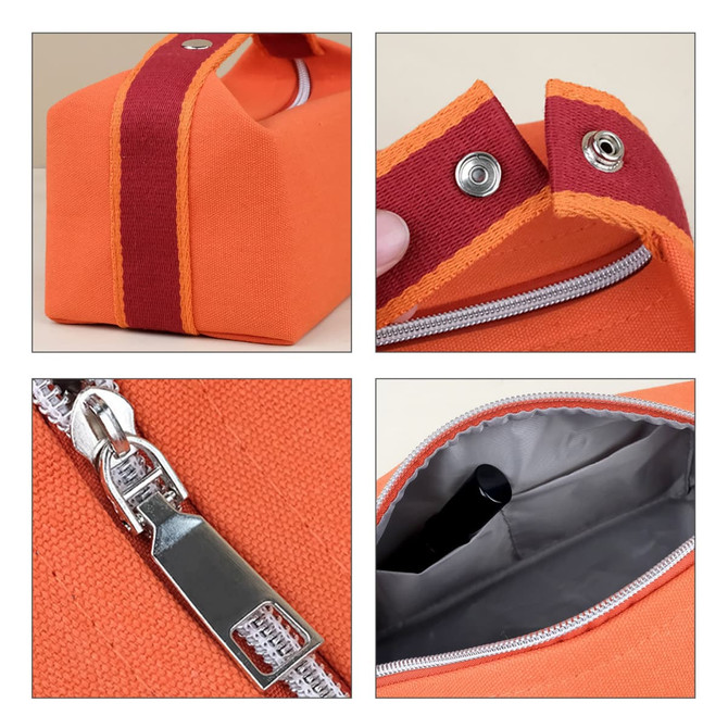 An orange portable canvas cosmetic bag with a maroon strap and silver zipper, featuring a snap closure and grey interior.