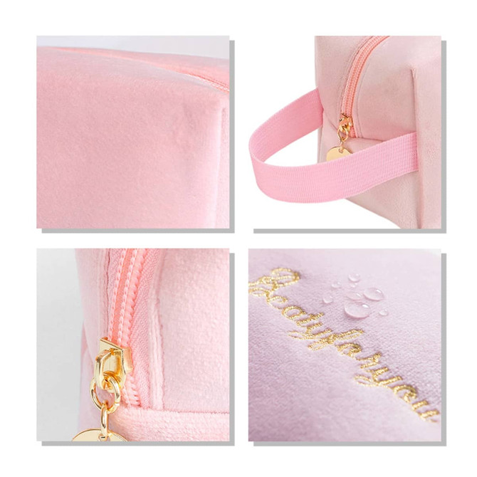 A flannel cosmetic bag in soft pink featuring a zipper and a strap, with a decorative logo in gold.