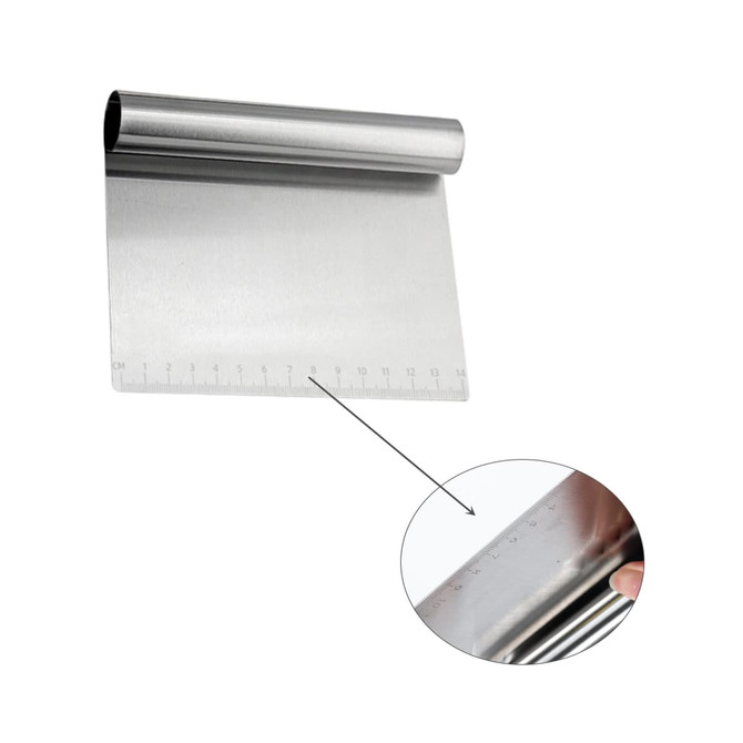 A stainless steel flour cutter with measurement markings along one edge, featuring a rounded handle.