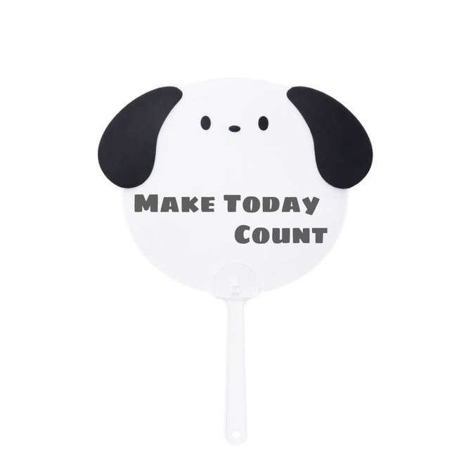 A custom-shaped hand fan in the design of a dog’s face, featuring black ears and a white body.