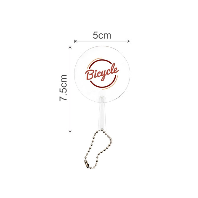 A clear PVC hand fan with a keychain, featuring a circular design and measuring 5x7.5 cm.
