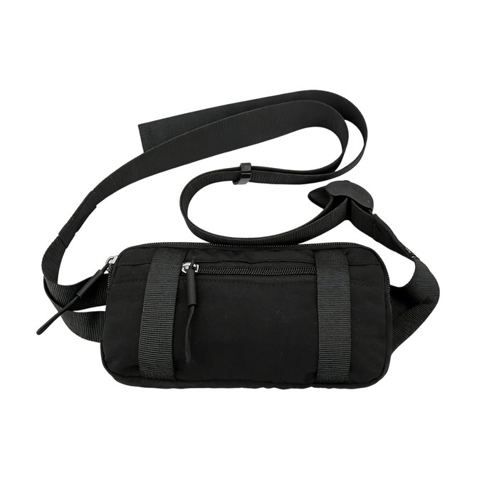 A black travel fanny pack with adjustable straps and a front zipper pocket. It features a logo on the material.