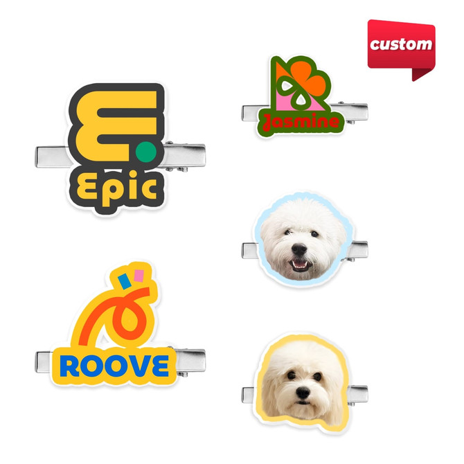A collection of custom-shaped acrylic hair clips featuring various colourful designs and a logo on each clip.