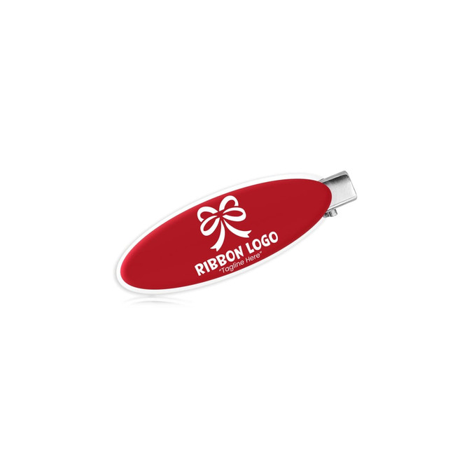 An oval acrylic hair clip in red with a silver clasp, featuring a logo on the surface.