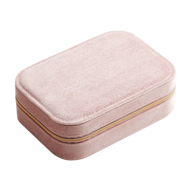 A pink velvet jewellery box with a compartment and a gold zipper. It features a soft, textured exterior.