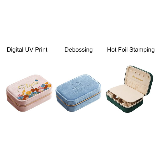 Three velvet jewellery boxes in pink, blue, and green, featuring different decorative techniques and compartments.