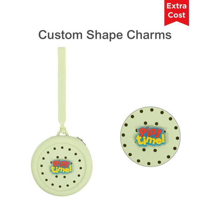A round, pale green silicone pouch with holes and a branding logo, featuring a detachable strap.