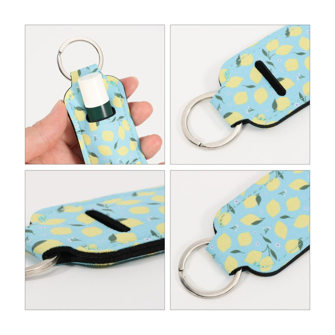 A neoprene lipstick bag featuring a blue background with yellow lemon patterns and a silver keyring attachment.