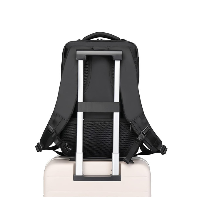 A black waterproof business backpack positioned on a white suitcase, featuring adjustable straps and a luggage pass-through.