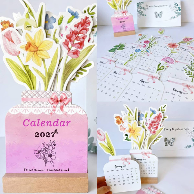 A floral desk calendar featuring colourful flowers in a vase design, with monthly pages and a wooden base.