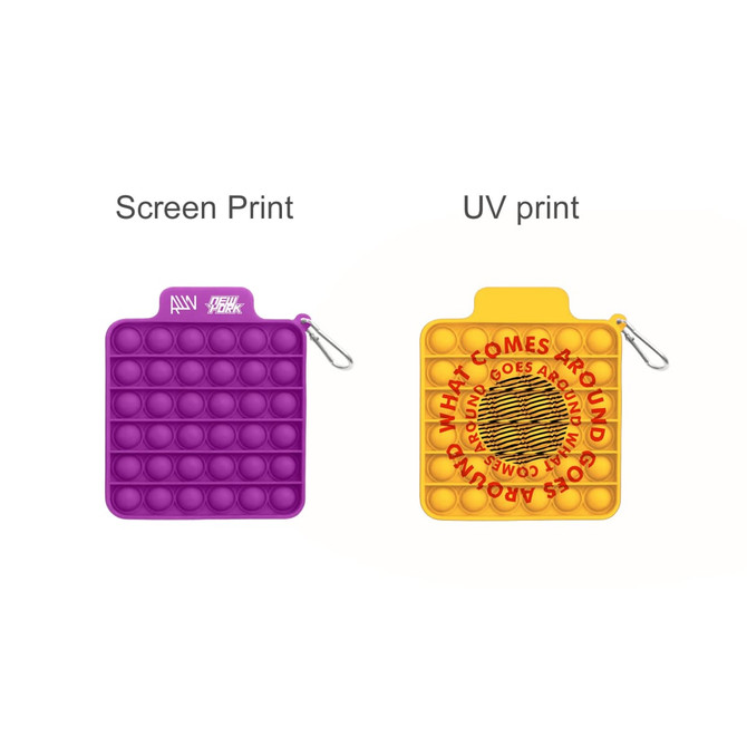 A purple and yellow square pop bubble board featuring different prints, with a clip attachment and branding.