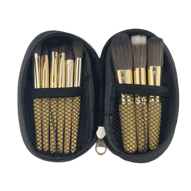 A zippered case containing nine makeup brushes with gold handles and black bristles, neatly organised inside.