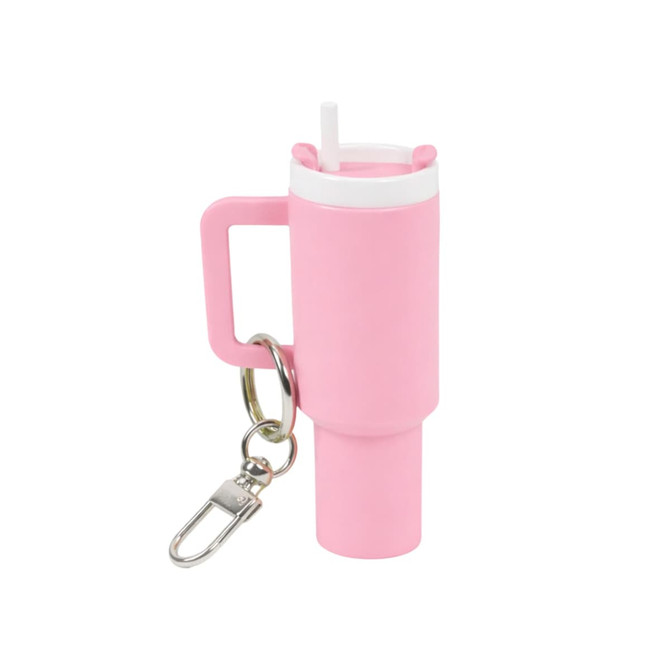 A pink mini tumbler keyring with a straw and a metal clip for attachment. Features a handle for easy gripping.