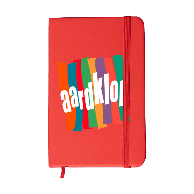 A red Minichroma A6 Notebook with a colourful design and an elastic band closure. It features a logo on the front.