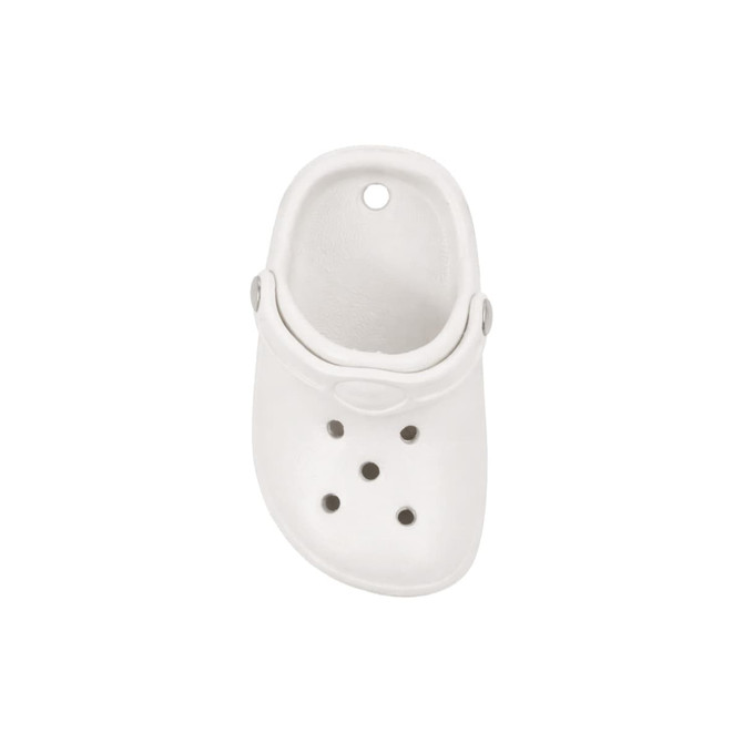 A white clog shoe fridge magnet featuring ventilation holes and a circular hole on top.